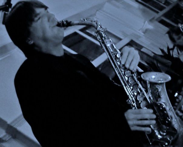 A blur of guitar and saxophone