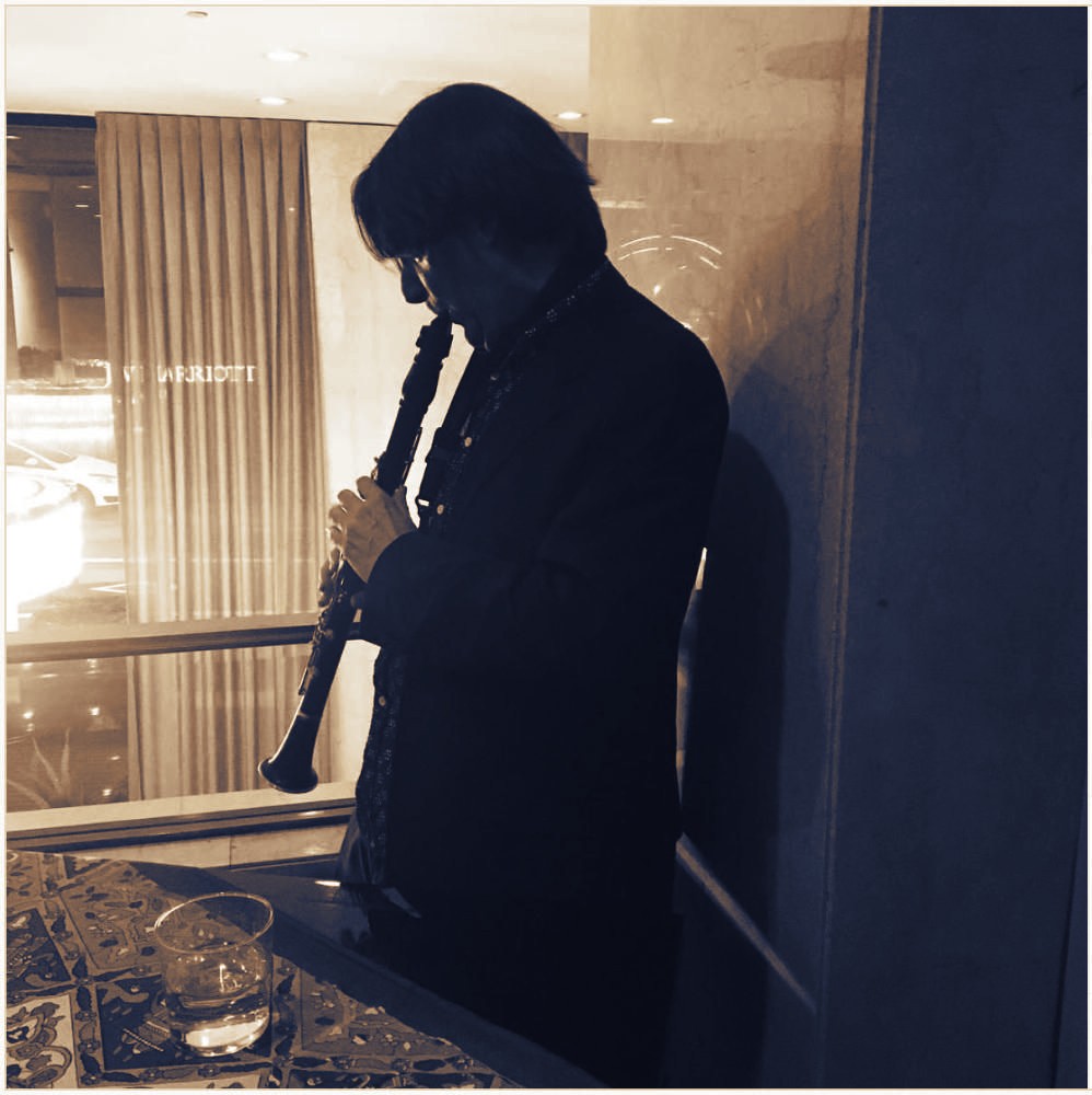Clarinet by the hotel window, after the set